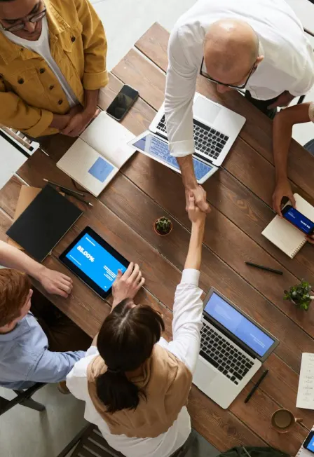 Two people holding hands symbolizing support and unity